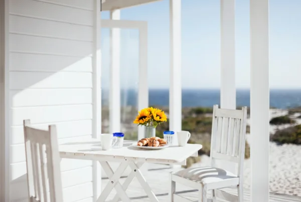 outdoor table and chairs on a porch of an ADU in Massachusetts coast